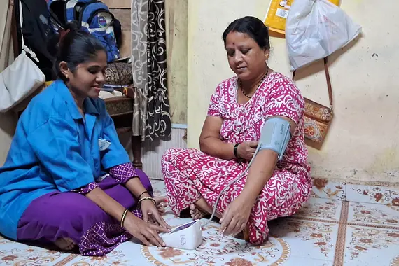 Woman checking her blood pressure